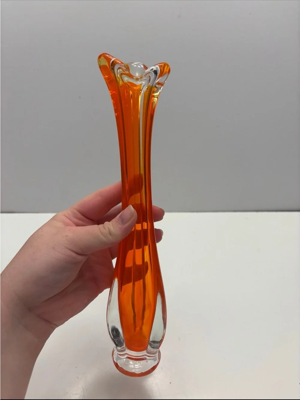 Vintage orange and clear glass swung bud vase
